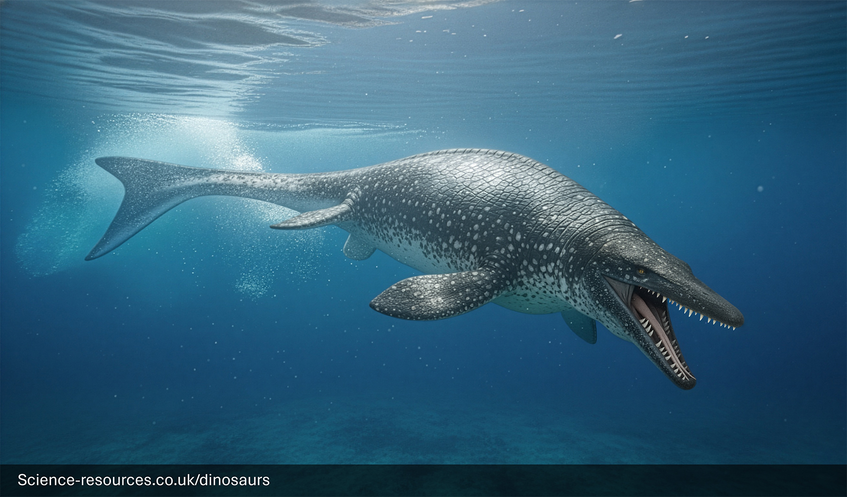 A menacing, photorealistic computer-generated image of a Mosasaurus swimming just below the ocean's surface. The giant marine reptile has a textured, scaly body that is dark blue-gray on top and pale white underneath. Its mouth is wide open, revealing rows of long, dagger-like teeth. Bright rays of sunlight stream down from the rippling water surface onto the creature and the dark seabed below.